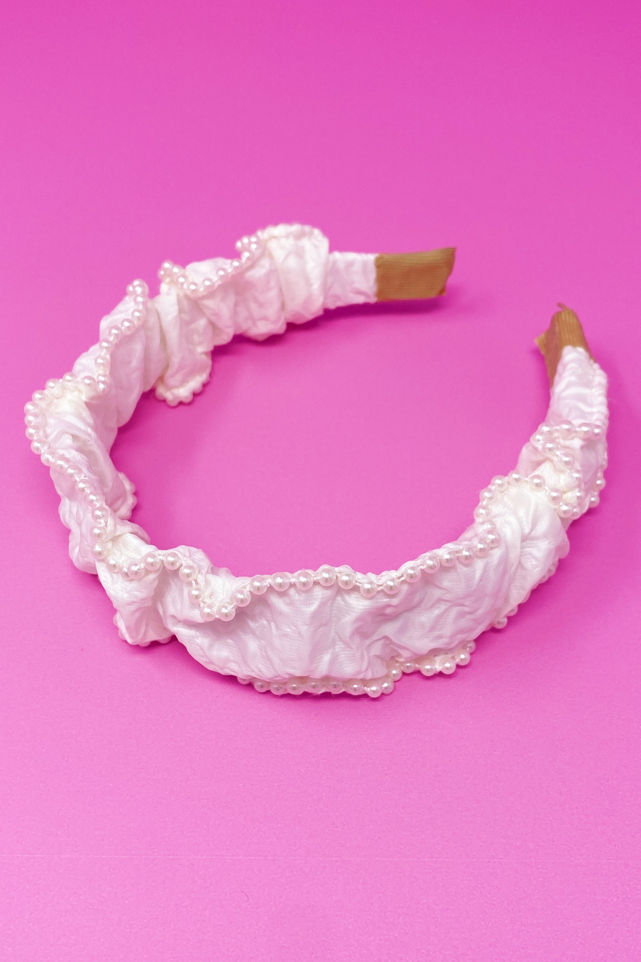 Elevate Your Style with the Elegant Pearl-Embellished Headband by Palace