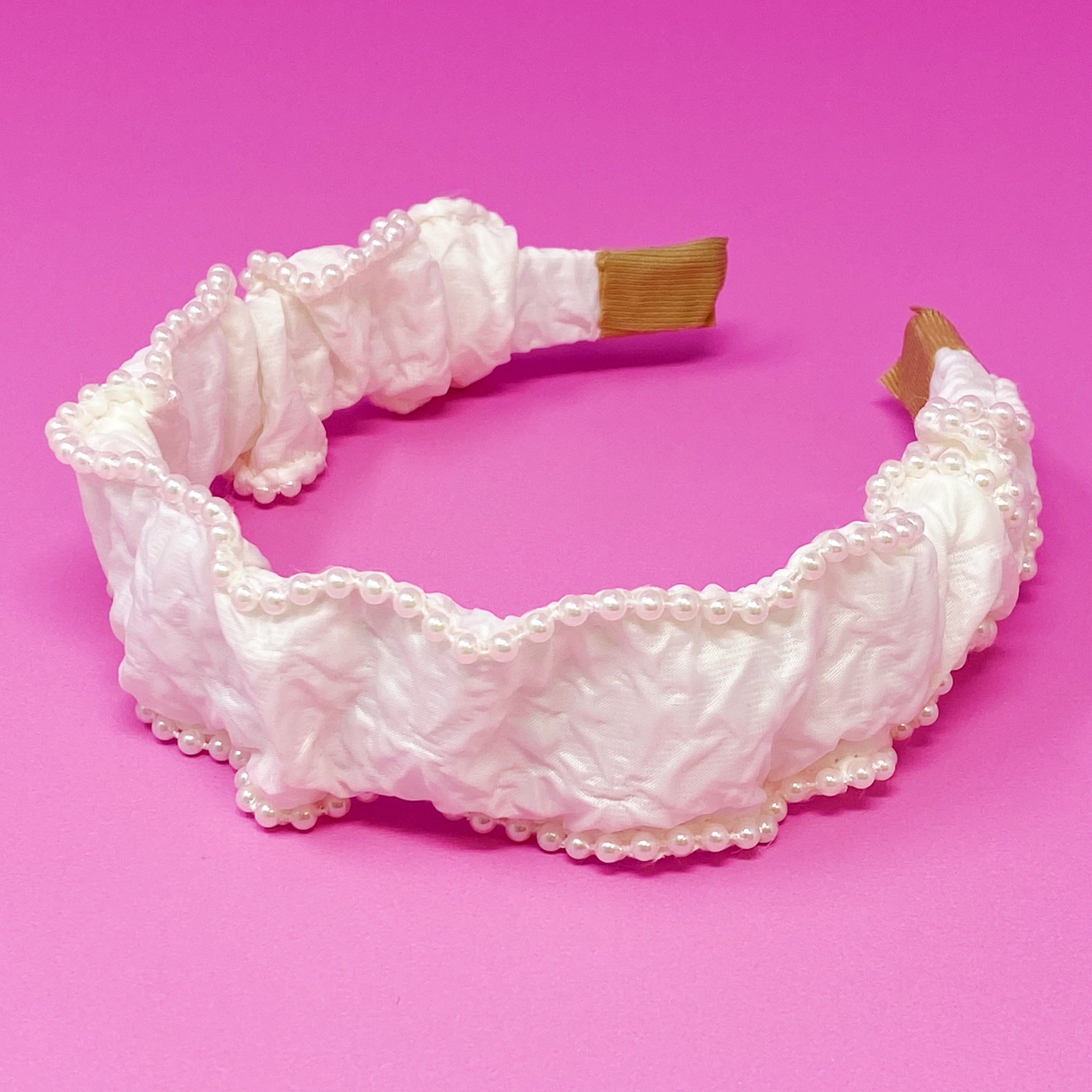 Elevate Your Style with the Elegant Pearl-Embellished Headband by Palace